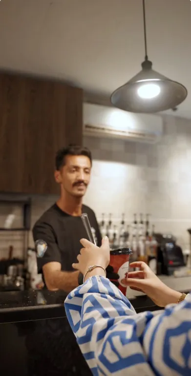 A coffee handed over the Canteen counter